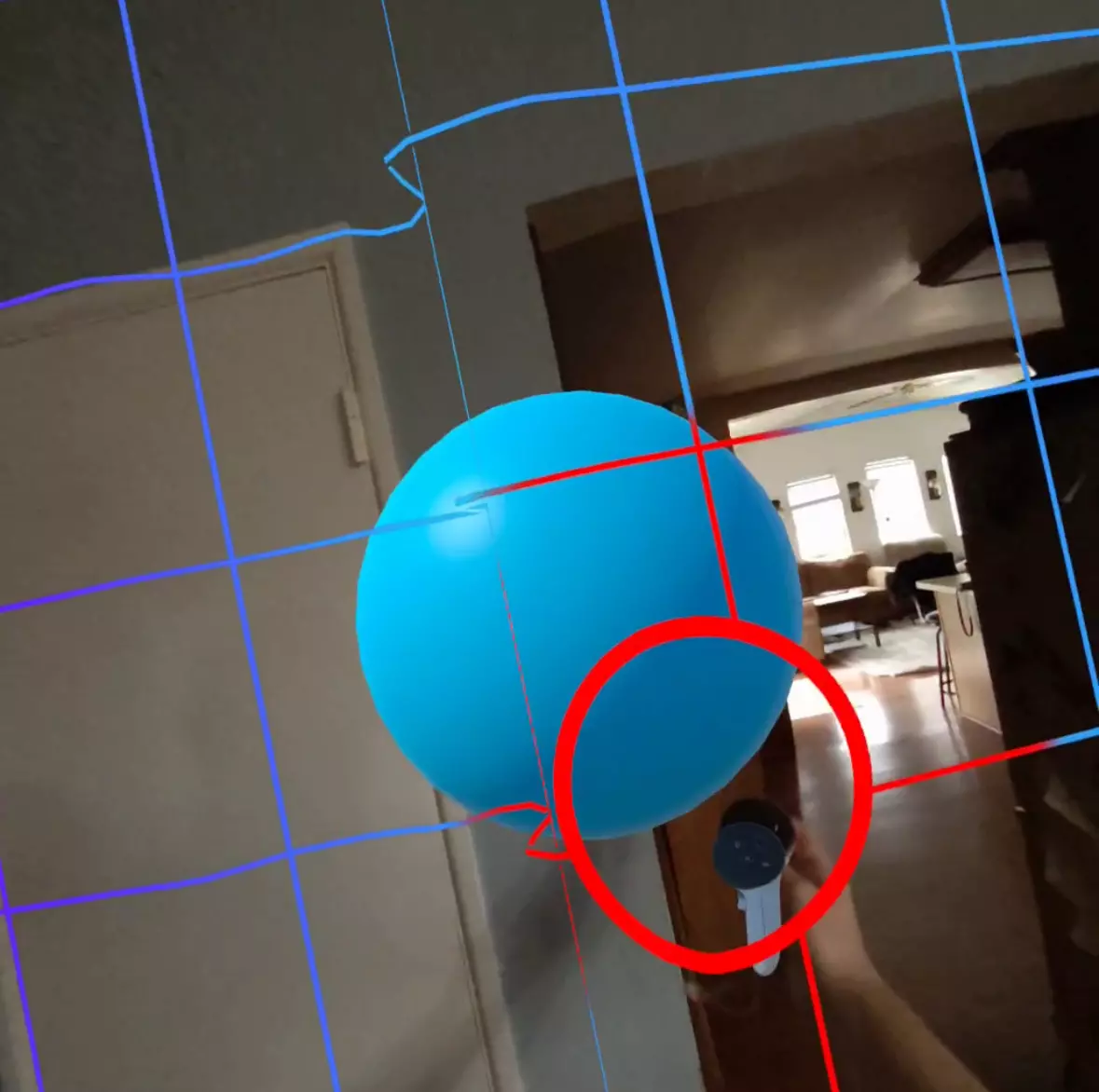 A blue sphere in a dining room with VR boundary lines